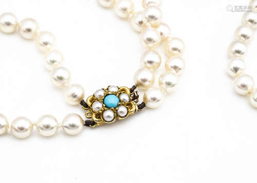 A double row cultured pearl necklace, with 9ct gold, turquoise and pearl set clasp. The graduated