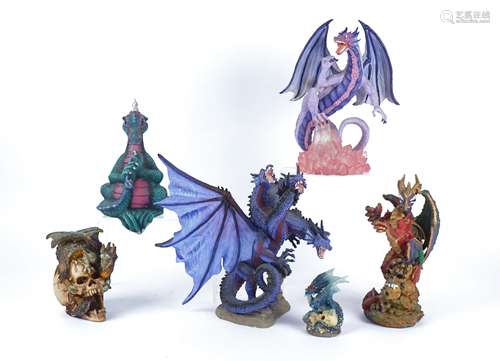 Three boxes of novelty resin dragon figures, to include 'Land of the Dragons Medium Amethyst