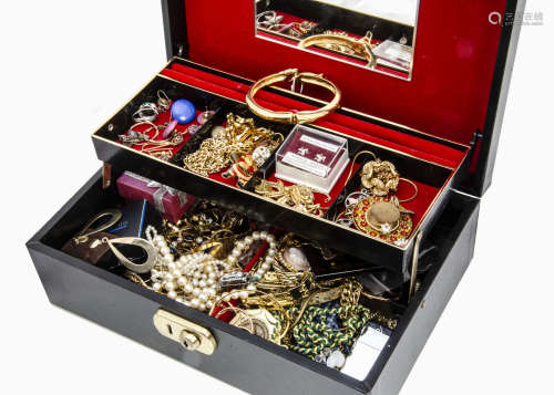 A collection of costume jewellery, in black hinged cantilevered jewellery box including brooches,