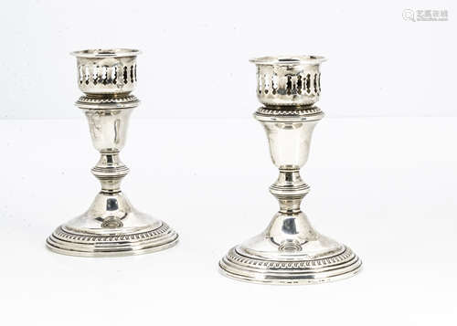 A pair of Art Deco period silver filled candle holders, with screw fitting sconces, 14cm, marked