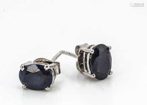 A pair of silver set sapphire ear studs