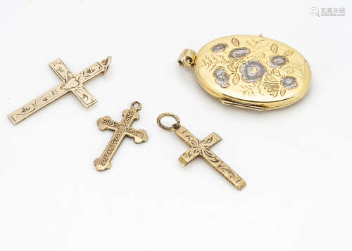 A collection of 9ct gold engraved crosses, and a two coloured gold oval floral decorated locket