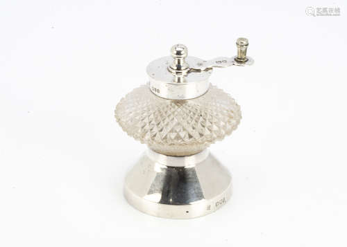 A late Victorian silver and cut glass pepper mill by Hukin & Heath, flared base with cut glass well,