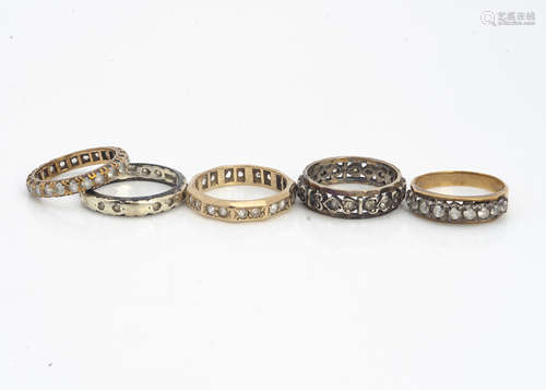 Four 9ct gold paste set full and half eternity rings, and another in silver, 10g (5)