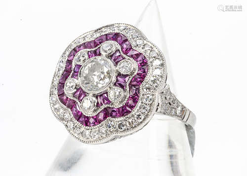 A Belle Epoque ruby and diamond tablet dress ring, with old cut within a pave ruby setting and a