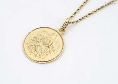 A Middle Eastern 18ct gold medallion and rope twist chain, with engraved design of an eagle
