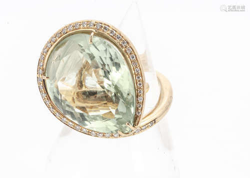 A large bespoke 18ct gold diamond and prasiolite dress ring, the pear shaped central green stone