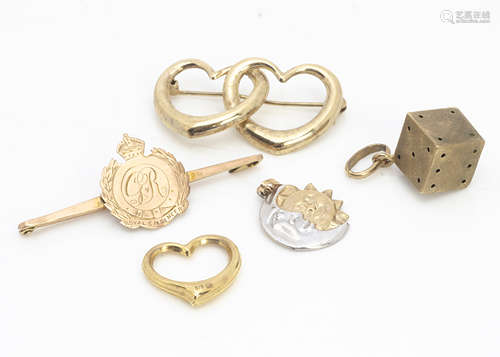 A collection of gold brooches and charms, including a 9ct gold sweetheart George V Royal Engineers