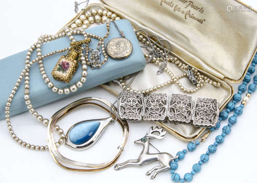 A collection of silver and costume jewellery including a coral stained pendant, a Mexican silver and