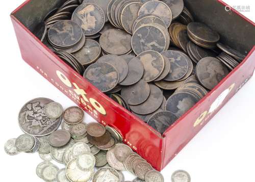 A collection of British coins, in an old OXO tin, including a Victorian crown, along with a quantity