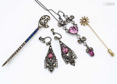 An early 20th Century paste set pink and colourless foil backed necklace and pendant, of bow design,