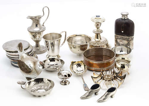 A collection of silver plated items, including a pair of small shoe pin cushions, an Egyptian plate,