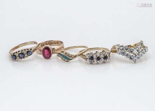 A 9ct gold sapphire and diamond three stone dress ring, ring size Q, a 9ct gold Edwardian wedding