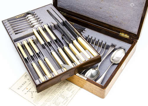 An early 20th Century silver plated canteen of cutlery by Walker & Hall, presented in an oak canteen