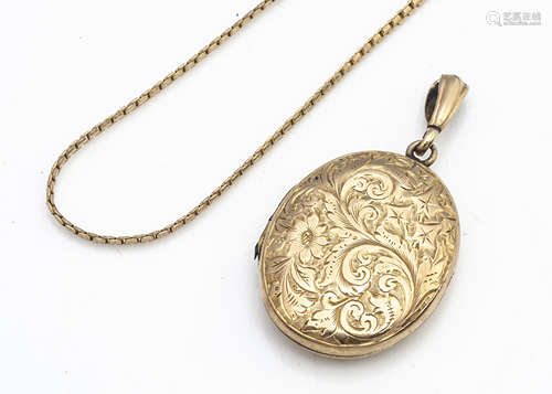 A 9ct gold oval locket with central heart cartouche, marked to bottom of oval, 4.2cm including