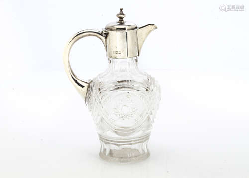 A nice Edwardian cut glass and silver mounted claret jug, with applied silver handle and hinged lid,