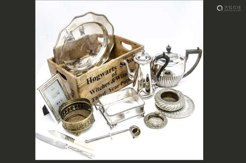 A collection of silver plate, including a coffee pot, teapot, flatware and more