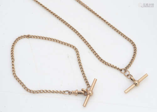 A 9ct gold watch chain style necklace and matching bracelet, the curb linked chains supporting T