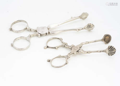 Two pairs of antique silver sugar tongs, one Georgian pair with initials MA, 11cm, the other pair of