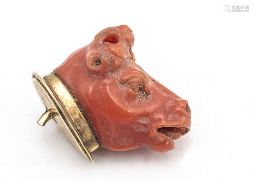 An early 19th Century Italian coral carved cows head, on a gold mount, the head missing horns and