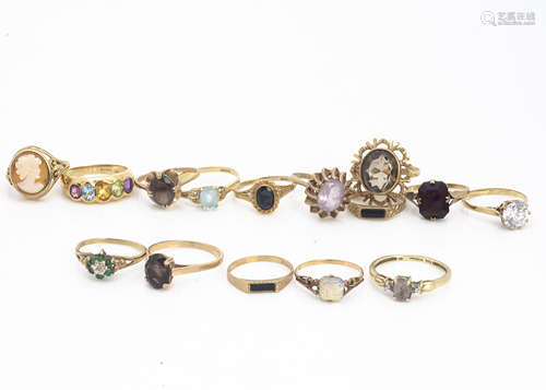 A quantity of 9ct gold gem set dress rings, including onyx, tourmaline, citrine, amethyst and