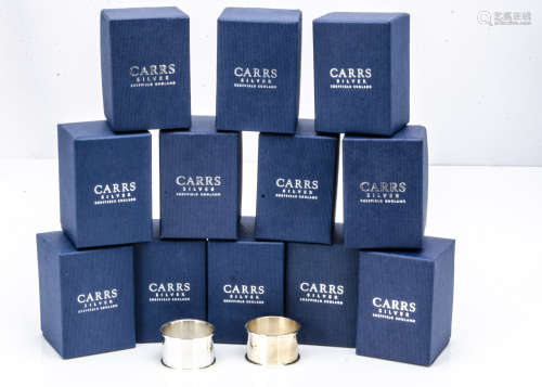A set of twelve modern and unused silver napkin rings from Carrs, each plain hallmarked ring in card