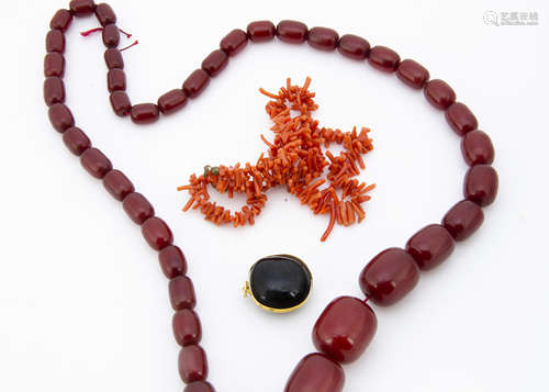 A graduated string of 'cherry amber' beads, 34cm together, 86.8g, largest bead 2.5cm, smallest 1cm