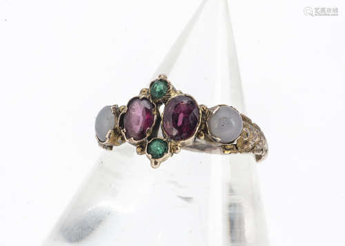 A Victorian garnet and paste ring, the oval mixed cut garnets set with green paste and opaque