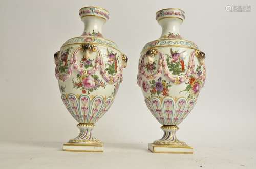 A pair of mid 19th Century Samson porcelain vases, with goats heads, swags, bows hand painted