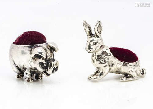 Two modern white metal miniature pin cushions, modelled as a pig, 2.5cm long, and a rabbit, 3cm