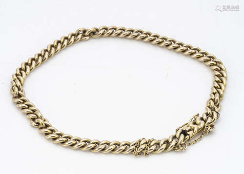 A yellow metal curb link bracelet, with box and tongue clasp, oval linked safety chain, unmarked,