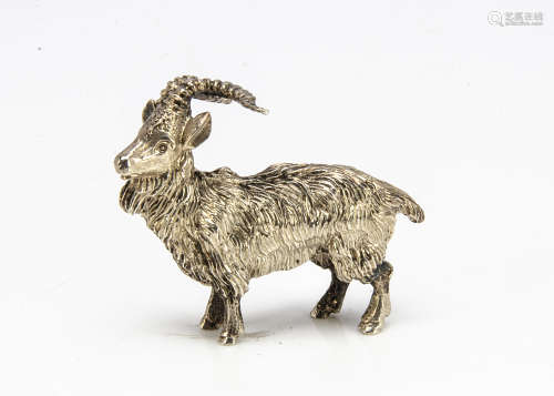 A small modern silver figure of a goat, 3.1ozt, 6.6cm long
