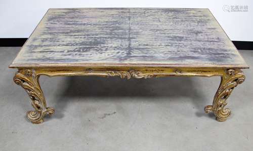 A contemporary rectangular coffee table in the Rococo style, with a distressed gilded finish, 80cm