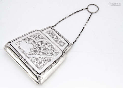 An early 20th Century silver purse by EDL, hinged and having engraved designs, 5.5ozt, with brown