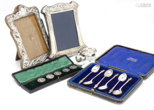 A set of five Art Nouveau silver buttons, in a case, together with two silver fronted photograph