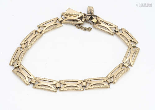 A continental yellow metal rectangular pierced link bracelet, with textured clasps and safety chain,