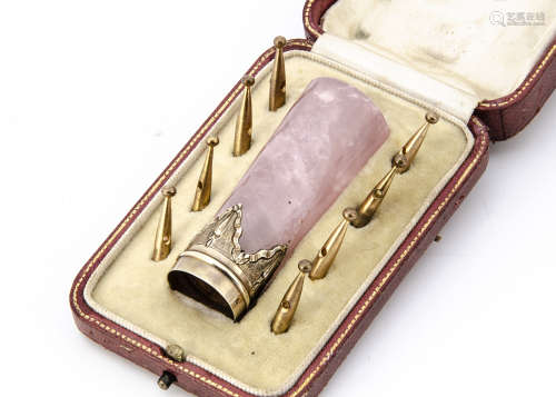 An Edwardian cased rose quartz and silver gilt parasol handle, with eight lacquered brass canopy