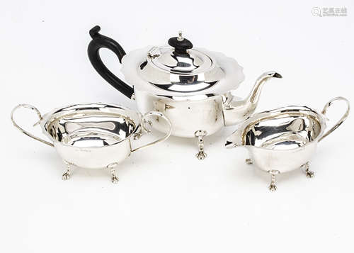 A George V silver three piece tea set by BG, having shaped flared rims, 17ozt, Birmingham 1925