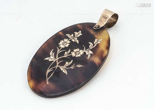 An Edwardian pique work oval pendant, with floral decoration and plain bale marked 9ct, 5cm x 3.2cm,