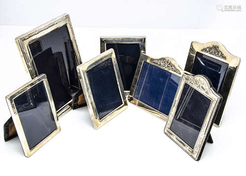 Seven modern silver fronted photograph frames, the largest 22cm high, ranging down to 16cm,