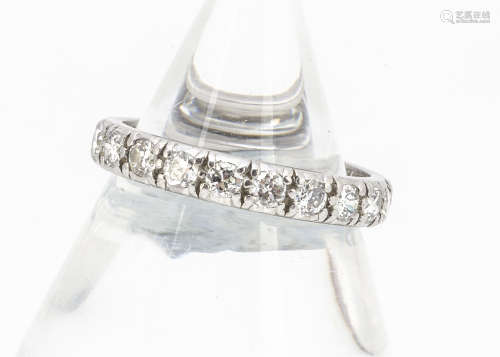 A diamond full eternity band, in white metal, old cut stones in raised claw settings, ring size P,
