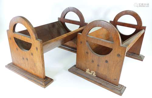 A pair of late 19th or early 20th Century mahogany book troughs, the sides with open split