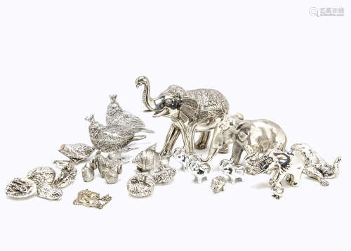 A group of white metal and silver plated animals and ornaments, including a small silver duck, 2.