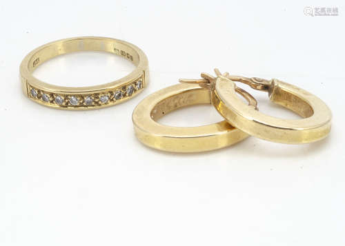 An 18ct gold half hoop eternity ring, the brilliant cuts in channel setting on hallmarked shank,