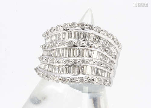 An 18ct gold diamond multi band dress ring, set with alternating rows of brilliant and baguette