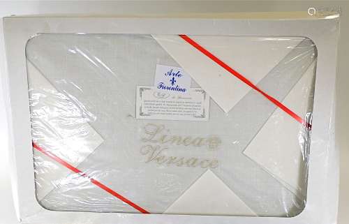 A 'Linea Versace' boxed set of towels and decorative linens, the case with several layers of