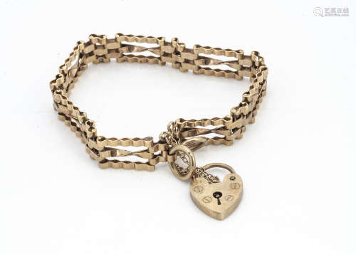A 9ct gold three bar gate link bracelet, with heart shaped padlock clasp, with safety chain, 18cm
