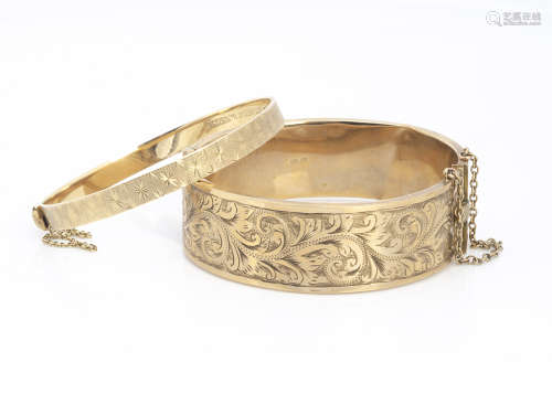Two 9ct gold bangles, both 5.5cm internal diameter, one slightly af, the other with star cut design,