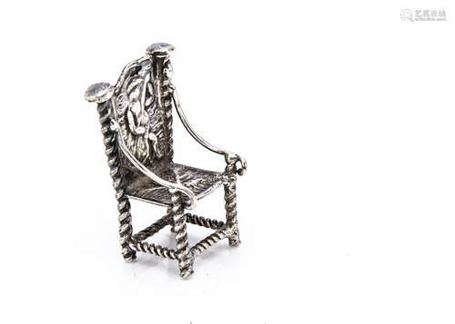 A continental miniature white metal chair, 2.4cm high, with throne style back and barley twist