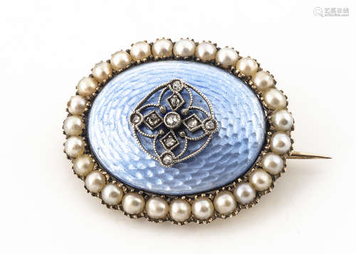 An Edwardian enamel diamond and seed pearl oval brooch, the blue enamel translucent ground set